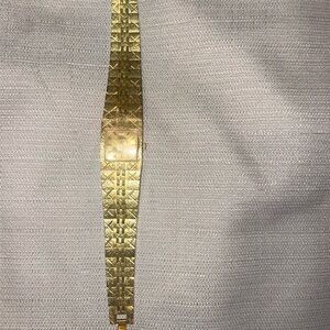 Genevieve classic watch gold-tone. Strap links are removable for smaller wear.